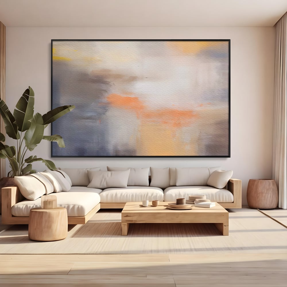 Tablou canvas cu pictura abstracta cu pete portocalii, in rama de aluminiu negru, pe perete intr-un living